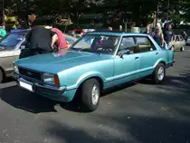 Ford Taunus TC2 1.6GL viertürige Limousine (Werksintern GBFS genannt). Der TC2 wurde 1976 als Nachfolger des  Knudsen  Taunus vorgestellt. Der abgelichtete Wagen entstammt dem Modelljahr 1979 und ist somit dem ersten Baujahr des  Facelift -Taunus zuzuordnen. Für eine solche viertürige Limousine mit dieser Motorisierung musste man mindestens DM 15.200,00 auf die Theke des Ford-Händlers legen. Der Vierzylinderreihenmotor hat einen Hubraum von 1593 cm³ und leistet wahlweise 68 PS oder 72 PS. 4. Ford Event am 02.09.2018 in Krefeld. 