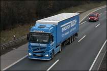 Actros 1848 der Hilchenbacher Spedition BUSCH ist in Richtung Norden unterwegs. (02.03.2009)
