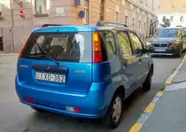 Rückansicht: metalblauer Suzuki Ignis II fotografiert in Pécs (Ungarn), September, 2019.