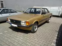 Ford Taunus TC2 1.6GL viertürige Limousine (Werksintern GBFS genannt). Der TC2 wurde 1976 als Nachfolger des  Knudsen  Taunus vorgestellt. Der abgelichtete Wagen entstammt dem Modelljahr 1979 und ist somit dem ersten Baujahr des  Facelift -Taunus zuzuordnen. Für eine solche, viertürige Limousine mit dieser Motorisierung, musste man mindestens DM 15.200,00 auf die Theke des Ford-Händlers legen. Der Vierzylinderreihenmotor hat einen Hubraum von 1593 cm³ und leistet wahlweise 68 PS oder 72 PS. Oldtimertreffen Nordsternpark/Gelsenkirchen im Juni 2019.