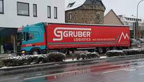 =Scania-Sattelzug von GRUBER-Logistics rollt im Dezember 2020 durch Fulda