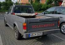 =VW Caddy steht auf einem Parkplatz im Sommer 2021