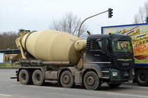 Ein MAN TGS 32.430 Betonmischfahrzeug mit Putzmeister Betonmischer am 03.02.22 Berlin Marzahn.