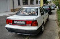 Rückansicht: Suzuki Swift Sedan. Foto: 04.2021.