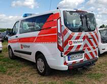 =Ford Custom Tourneo der Malteser steht im Mai 2022 auf dem Parkgelände der RettMobil