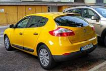 Rückansicht: Renault Mégane Mk3 in Jaune Sport. Die Aufnahme stammt von Mai, 2021.