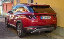 Rückansicht: Hyundai Tucson Mk4 in Sunset Red Foto: August, 2021.