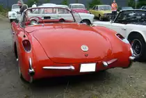 Heckansicht eines Chevrolet Corvette C1 aus dem Jahr 1956 im Farbton omaha orange. Oldtimertreffen an der  Alten Dreherei  in Mülheim an der Ruhr am 18.06.2023.