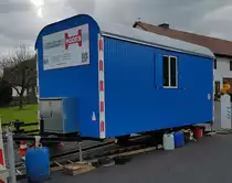 =Bauwagen des Bauunternehmens HODES steht im April 2023 in Petersberg-Marbach