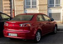 Rückansicht: Mitsubishi Lancer IX in der Farbe  Orient Red . Foto: Dezember, 2022.