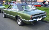 Profilansicht einer viertürigen Ford Taunus TC Limousine im Farbton onyxgrün aus dem Jahr 1973. Oldtimer-Revival auf dem Gelände der Kokerei Zollverein in Essen am 28.07.2024.