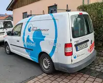 =VW Caddy von MEIN BADEZIMMER steht auf einer Baustelle in Petersberg, 10-2024