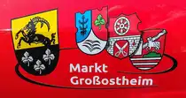=Wappen vom Markt GROßOSTHEIM und seinen Ortsteilen, angebracht am VW Tiguan der dortigen Feuerwehr, gesehen auf dem Parkplatz der 2025er Rettmobil in Fulda