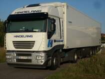 Rumnische IVECO-Zugmaschine und deutscher Hnger am 31.Juli 2009 in Bergen/Rgen.