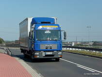 MAN LKW der Firma Duisburger Express G�terkraftverkehr nah+fern Sonderfahrten f�hrt am 24.August.2009 �ber eine Br�cke Richtung Hafengebiet!