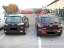 Mazda 2 umd Mazda 3 Heck-Ansicht.