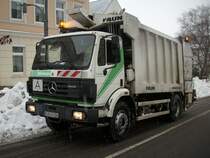 Mercedes-Mllentsorgungsfahrzeug unterwegs am 11.Februar 2010 in Bergen/Rgen
