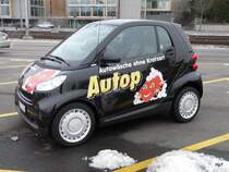 Schwarzer Werbe Smart in der Stadt Zrich am 16.01.2010