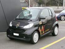 Schwarzer Werbe Smart in der Stadt Zrich am 16.01.2010