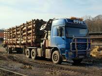 Actros 3354 Holztransporter mit Ladekran in Stolberg am 24.03.2010. 