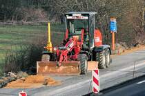 New Holland Grader F 106 6A auf der Baustelle A61 bei Heimerzheim - 18.03.2010