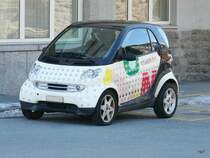 Engadin Bus - Kleinster Engadin Bus der Flotte ein Smart in St.Moritz am 07.04.2010