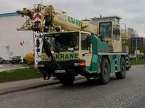 Autokran von H.N.Krane unterwegs am 27.April 2010 durch Bergen/Rgen.