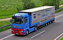 MAN Pritschenauflieger auf der A 61 bei Weilerswist - 28.05.2010