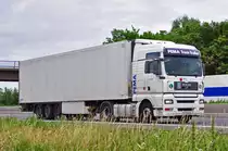 MAN TGA 18.440, gesteuert von einer  Truckerin  (jetzt nicht mehr erkennbar)auf der A61 bei Heimerzheim - 05.07.2010