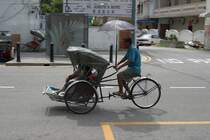 Rikscha in Fahrt am 16.Mai 2009 in George Town auf der Insel Penang/Malaysia.