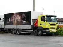 Scania R 420 mit Pritschenaufbau in Biel am 19.06.2010