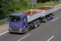 ..MAN -B�SSING  -  als H�ngerzug mit Abrollcontainer...gelenkt von einem WM-Fan am 30.6.10