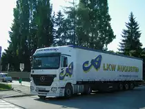 ACTROS1844 der Spedition Augustin kurvt durch das Stadtgebiet von Ried;100714