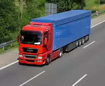 MAN - Sattelzug in schlichtem rot-blau in Richtung Frankfurt unterwegs - 30.6.2010 