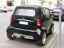 Smart mit Traktor-R�der. Aufgenommen: Juli 2010.