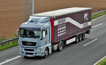 MAN mit Pritschenauflieger auf der A61 bei Weilerswist - 10.09.2010