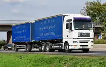 MAN D20 TGA 25.430  Spedition Humbert  auf der A61 bei Miel - 23.09.2010