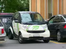 Scharz-Weisser Smart mit Werbung in Lausanne am 09.09.2010