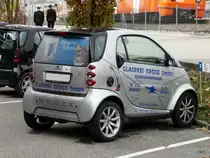 Silbriger Smart mit Werbung in Sch�nb�hl am 22.10.2010