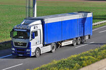 MAN mit Pritschenauflieger  Fchtener , A61 Rheinbach 21.10.2010