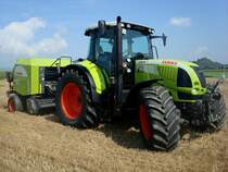 Claas Arion 640, Allradschlepper, 6-Zyl.Turbo-Diesel, 6788ccm, 155PS, 
angehngt eine Ballenpresse von Claas, Traktorentreffen Hausen/Mhlin, Sept.2010