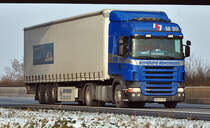 Scania R 420  B. Hvelmann  - A61 bei Miel 03.12.2010