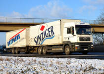 MAN TGA 24.430 Tandemzug  Ruettgers Transporte  auf der A61 bei Miel - 15.12.2010