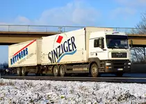 MAN TGA 24.430 Tandemzug  Ruettgers Transporte  auf der A61 bei Miel - 15.12.2010