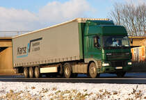 DAF CF mit Pritschenauflieger  Karst Spedition & Logistik  auf der A61 bei Miel - 15.12.2010