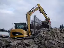 308D schichtet Abruchmaterial auf einen Haufen;110121