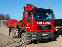 MAN TGM 13.250 mit MKG Kranaufbau der Firma Lube & Krings aus Aachen steht am 08.02.2011 auf dem Seffenter Weg in Aachen auf der Campusbaustelle der Rwth.