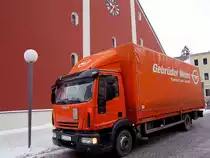 IVECO,EUROCARGO-120E22 von Gebr. Weiss bei seiner Zustelltour vor der Rieder Stadtpfarrkirche;110104