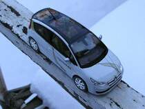 Citroen C4 . Hersteller: Norev, Masstab: 1/43. 
Foto: Januar 2011