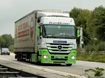 Mercedes Actros mit Planenauflieger am 12.08.2011 auf der A4 kurz hinter der Niederlndischen Grenze.